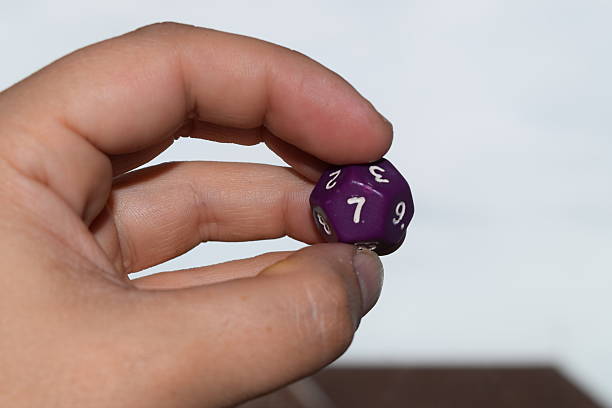 istock holding vitual 12 sided role playing game dice numbers background 545553586