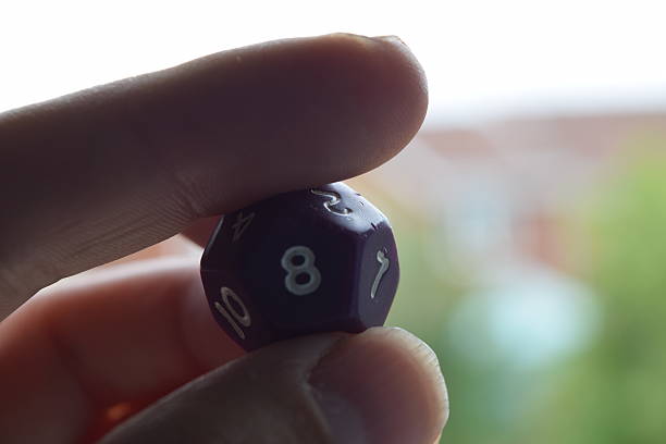 istock holding vitual 12 sided role playing game dice numbers background 545553606