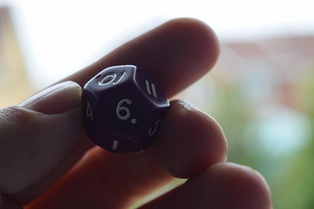 istock holding vitual 12 sided role playing game dice numbers background 545553610