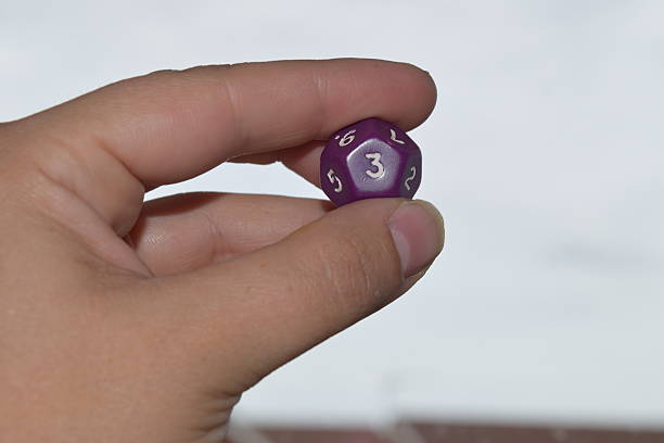 istock holding vitual 12 sided role playing game dice numbers background 545553614