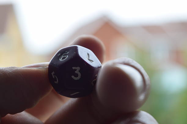 istock holding vitual 12 sided role playing game dice numbers background 545553616