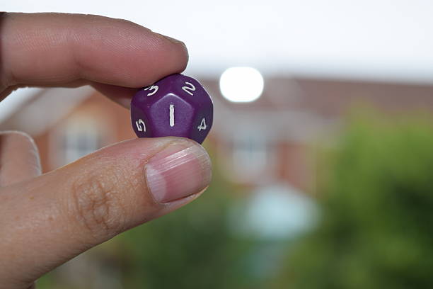 istock holding vitual 12 sided role playing game dice numbers background 545553622
