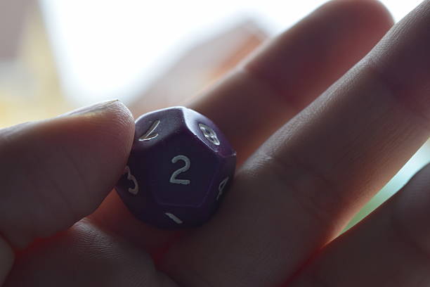 istock holding vitual 12 sided role playing game dice numbers background 545553624