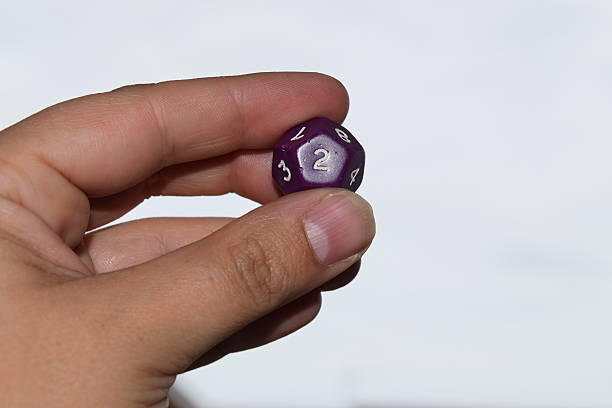 istock holding vitual 12 sided role playing game dice numbers background 545553626