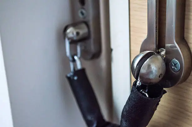 A door chain used to keep the door of a home secure. It allows for the door to be opened at a set amount to see who is on the other side.