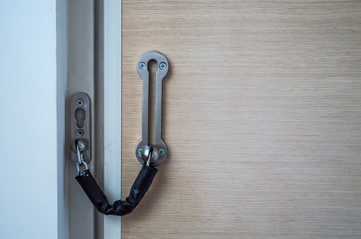 Door Chain/Lock on a Wooden Door Front View
