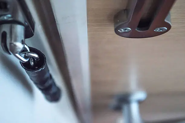 A door chain used to keep the door of a home secure. It allows for the door to be opened at a set amount to see who is on the other side.