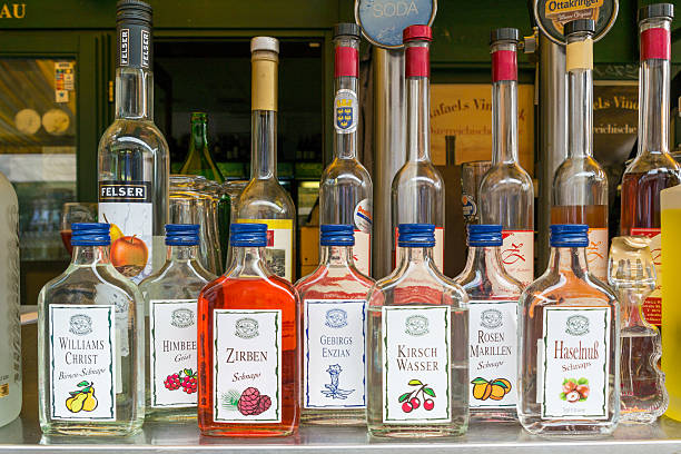 Vienna, Austria - May 23, 2016: Bottles with schnapps for sale in market stand on Naschmarkt in Vienna, Austria