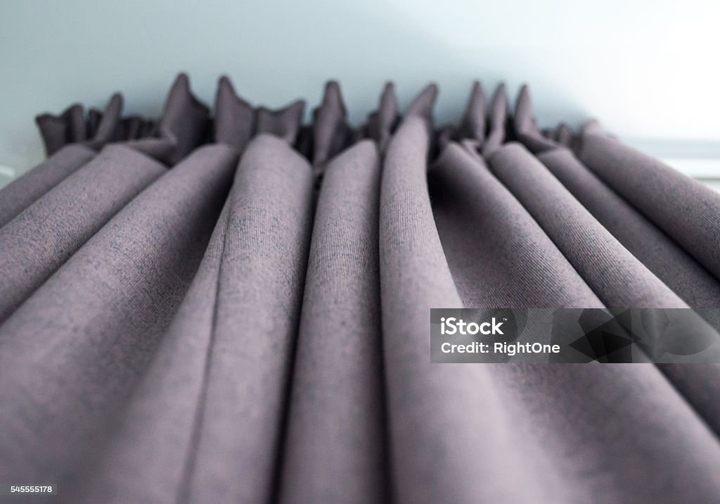 High-quality Grey Curtains Underneath View An under view of some thick grey curtains. Curtain Stock Photo