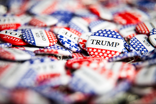 La Habra, United States - July 8, 2016: Close up of Vote election buttons, with red, white, blue and stars and stripes. Donald Trump is the republican candidate for president in the United States