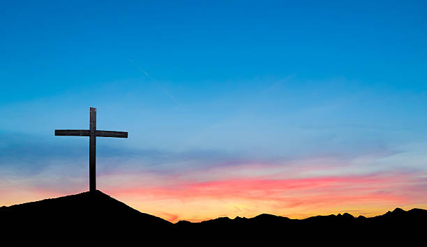 istock Cross on hill at sunset or sunrise 545559488
