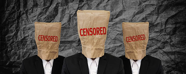 Group of businessman, brown paper bag on head with "CENSORED" Group of businessman, brown paper bag on head with "CENSORED" word on black crumpled texture anonymous businessman with paper bag on his head stock pictures, royalty-free photos & images