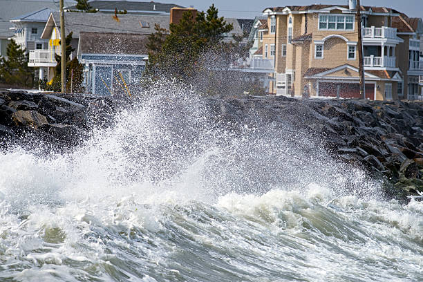 istock Waves Crashing against Seawall 545564106