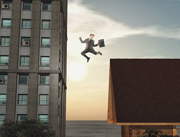 istock Young businessman jumping 545564952