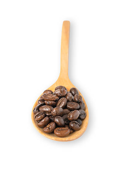 istock coffee beans in wooden spoon isolated on white background 545566066