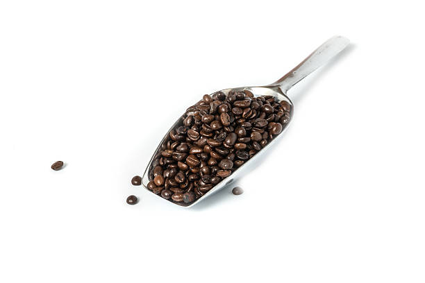 istock roasted coffee on metal scoop isolated on white 545566098