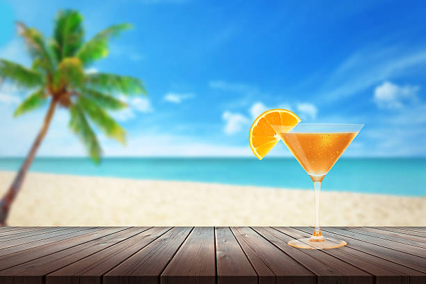 istock Cocktail on wooden table. Beach and the sea. 545567324