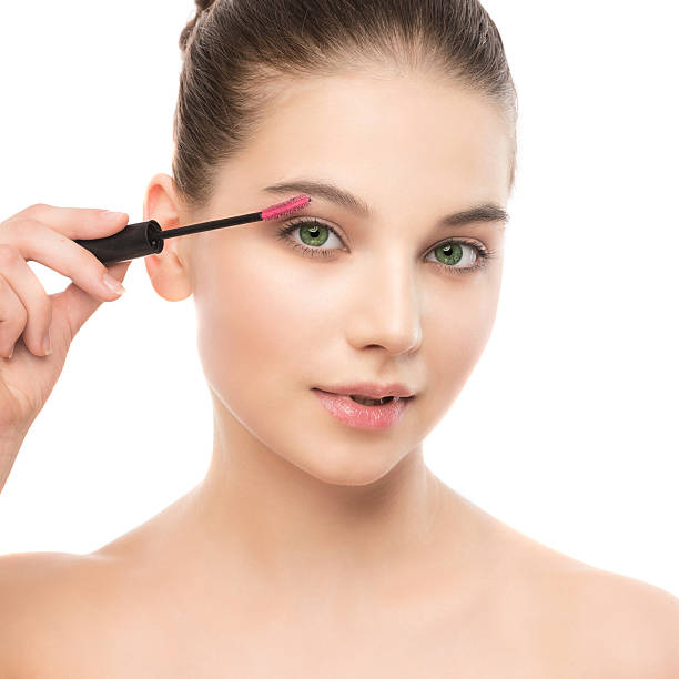 istock Eye make up apply. Mascara applying closeup, long lashes. makeup 545568012