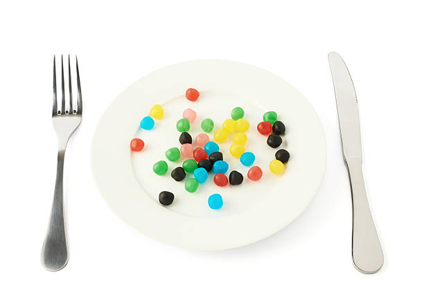 istock Multiple colorful candies in a plate isolated 545570032