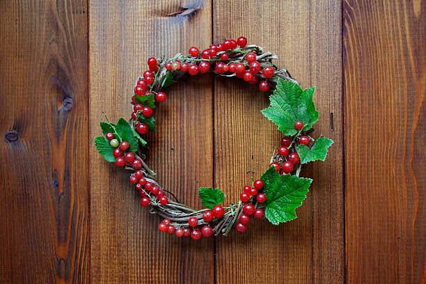 istock Wreath with currants on wooden background 545570558