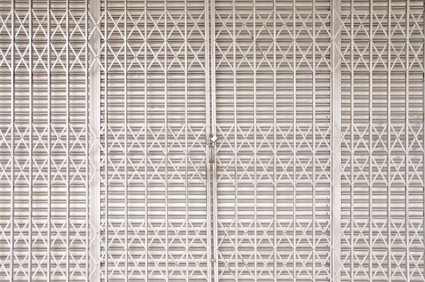Closed shutters and metal accordion gate