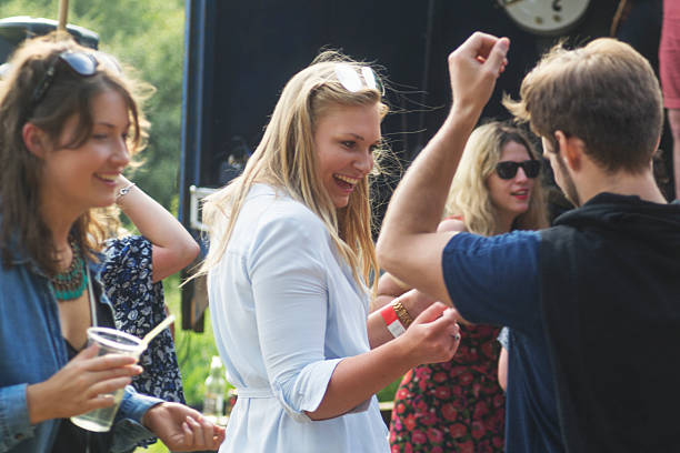 istock Dancing and drinking at the music festival 545571510