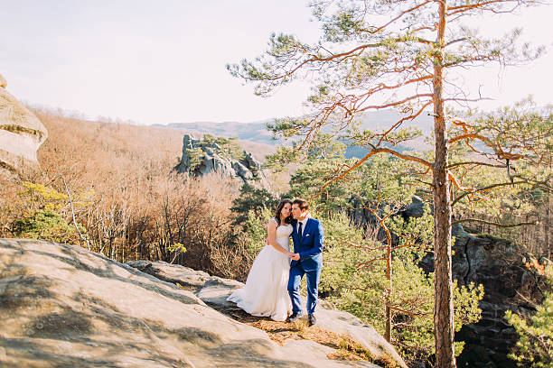 istock Handsome groom is gently holding his elegant new wife standing 545572098