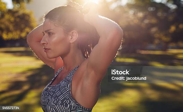 Tough Young Woman Getting Ready For Training Stock Photo - Download Image Now - Exercising, Close-up, Human Face