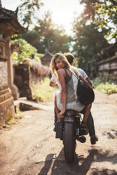istock Young couple riding motorcycle 545573724
