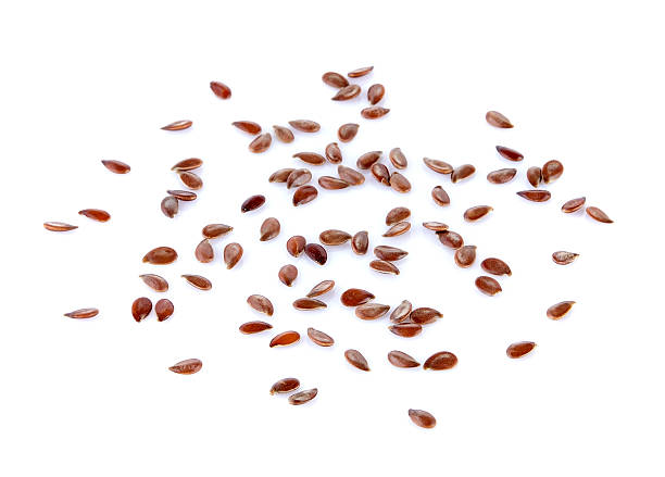 istock Flax seeds heap isolated on white background 545574198