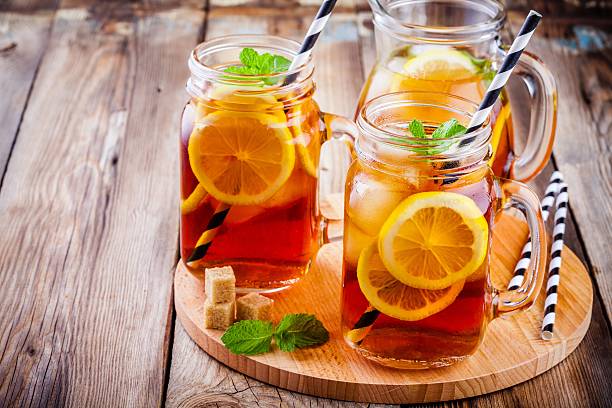 istock ice tea with slice of lemon in mason jar 545575510