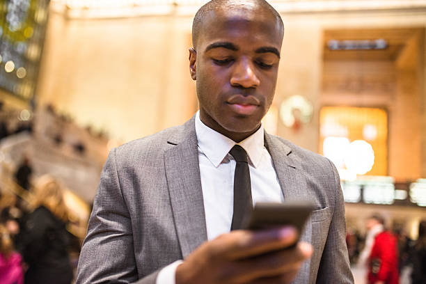 istock business man portrait in nyc sending sms 545576036