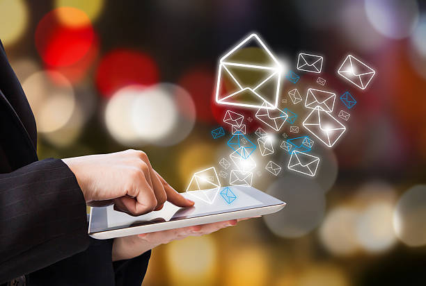 Business woman sending email