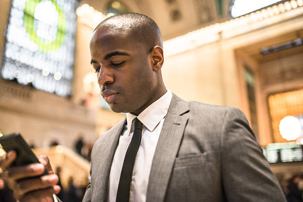 istock business man portrait in nyc sending sms 545576134