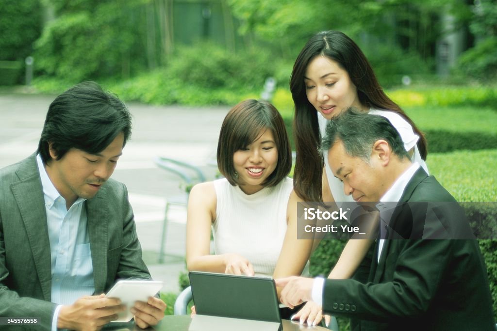 Japanese Using Computer Japanese People Using Laptop Computer And Tablet Computer Stock Photo ...