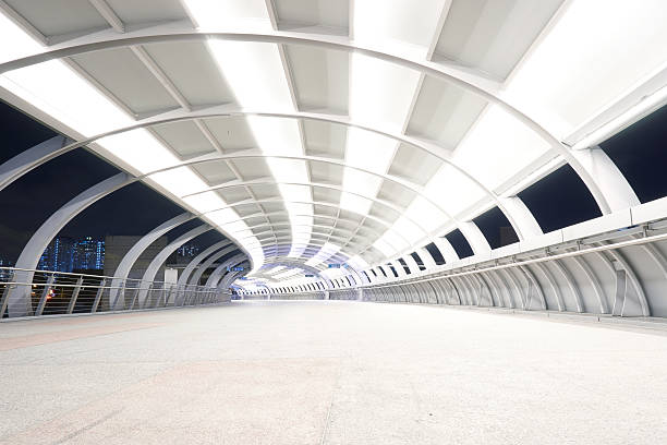 istock long corridor futuristic design walkway night time 545576624