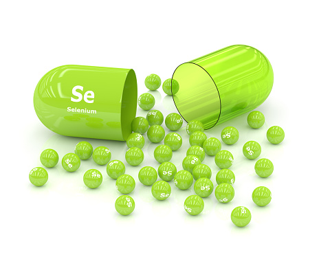 3d rendered selenium Se pill over white background. Concept of dietary supplements