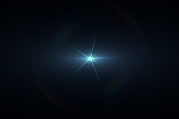 istock Star Shaped Cyan Lens Flare on Black Background 545584076