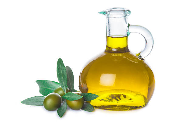 istock Olive oil bottle with leaves isolated on white background 545585900
