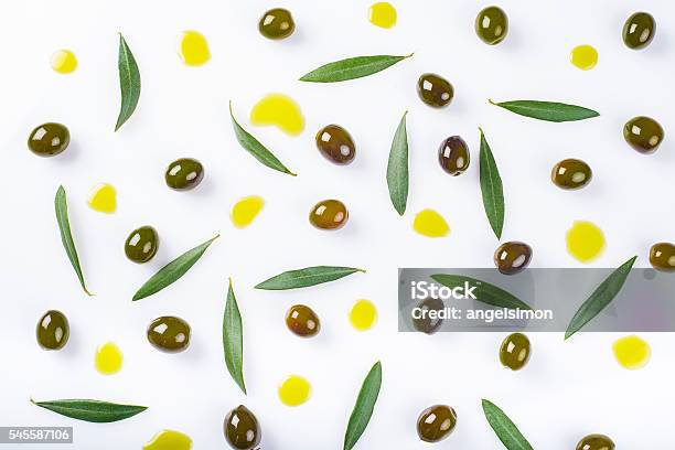 Olives Leaves And Oil Drops On A White Background Stock Photo - Download Image Now