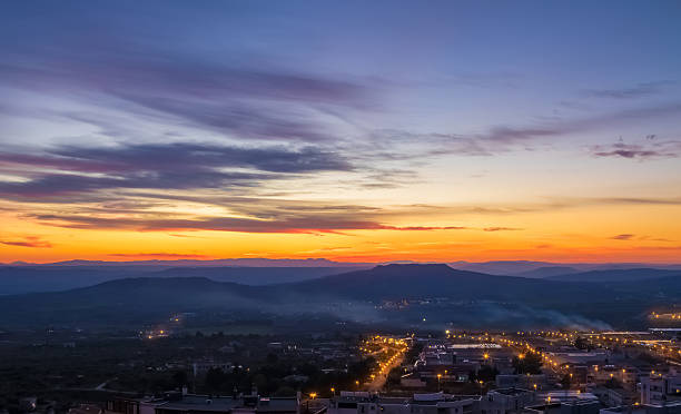 istock sunset scene with mountains in background and city Matera 545589484