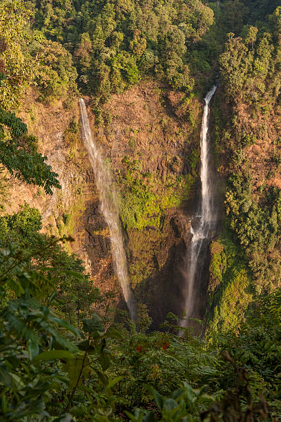 istock Raging water flowing down waterfall during rainy season showing 545591208