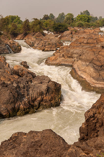 istock Raging water flowing down waterfall during rainy season showing 545591544