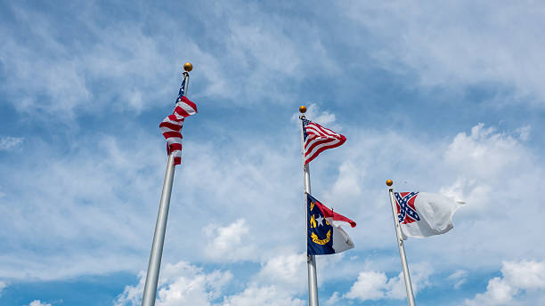 istock USA Flag next to North Carolina flag 545592986