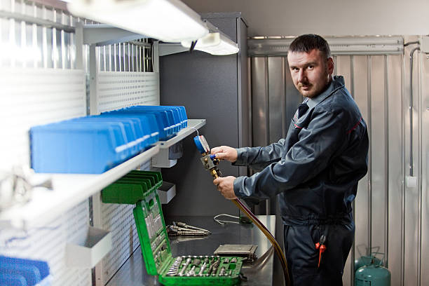 istock filling automotive air conditioners. service air conditioner 545593294