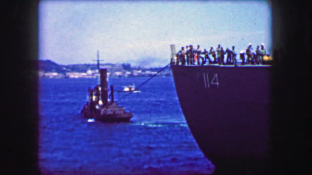 1944: Tugboat pulling USS General William Mitchell (AP-114) troopship maiden voyage.