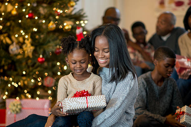 istock Little Girl Opening Her Present 545634118