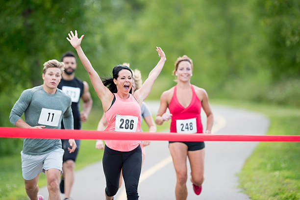 istock Breaking the Ribbon at the Finish Line 545634786