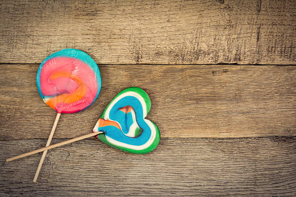 istock Colorful lollipops on the wooden surface 545635746