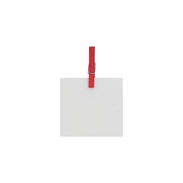 istock blank white Notepaper with paperclip on white background. 545637342